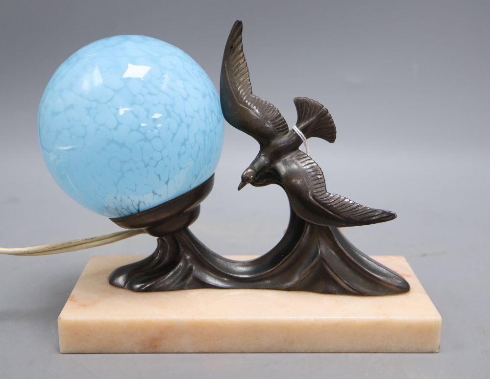 An Art Deco lamp of seagulls on marble stand and blue shade, height 17cm